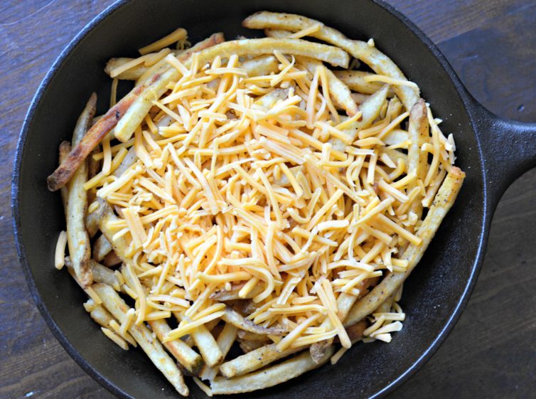Carne asada fries with cheddar cheese