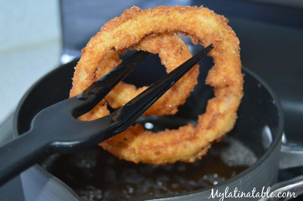 Frying onion rings to a golden brown.