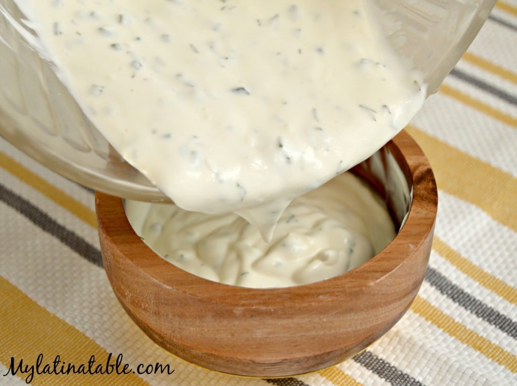 Pour homemade ranch dressing into a bowl for a delicious dip. 