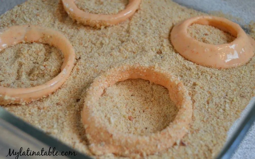 Adding breadcrumbs to onion rings