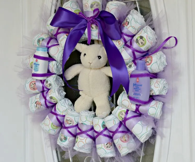 This Diaper Wreath is a perfect option for your next baby shower. It is easy to make and so adorable!