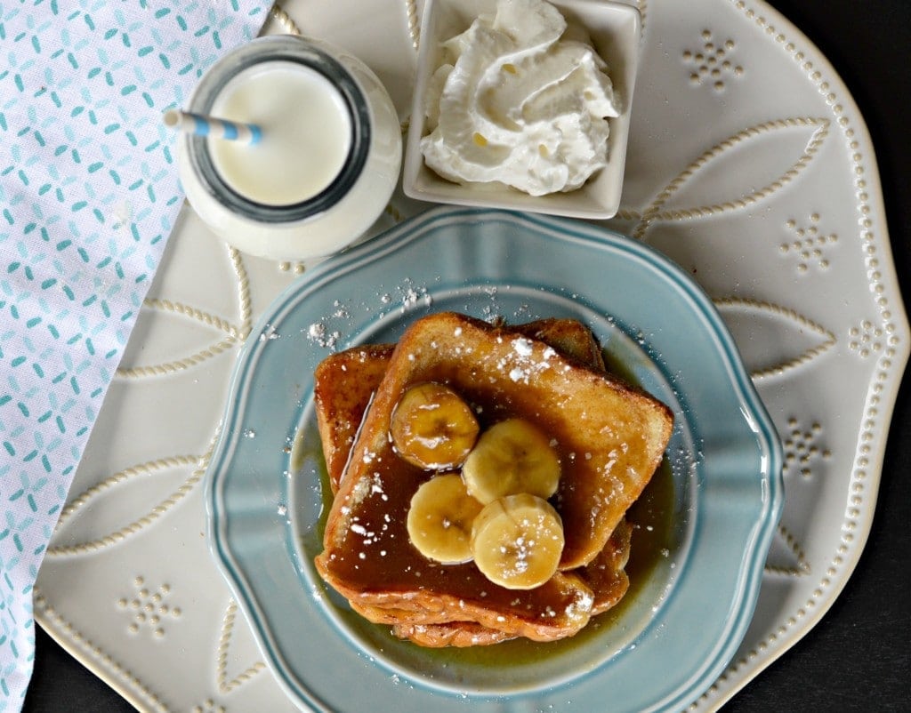 French toast recipe on a plate with caramel and banana sauce