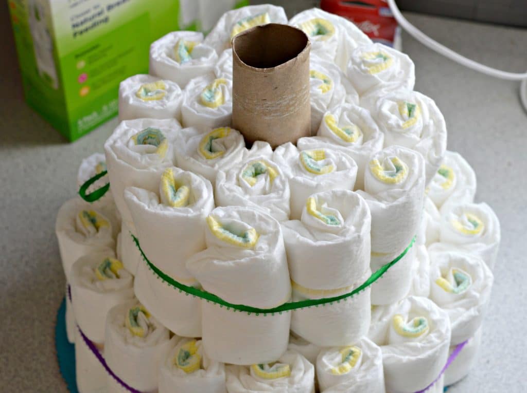 Master this Diaper Cake and you will be the hit at your next baby shower. It is easy and fun to make!