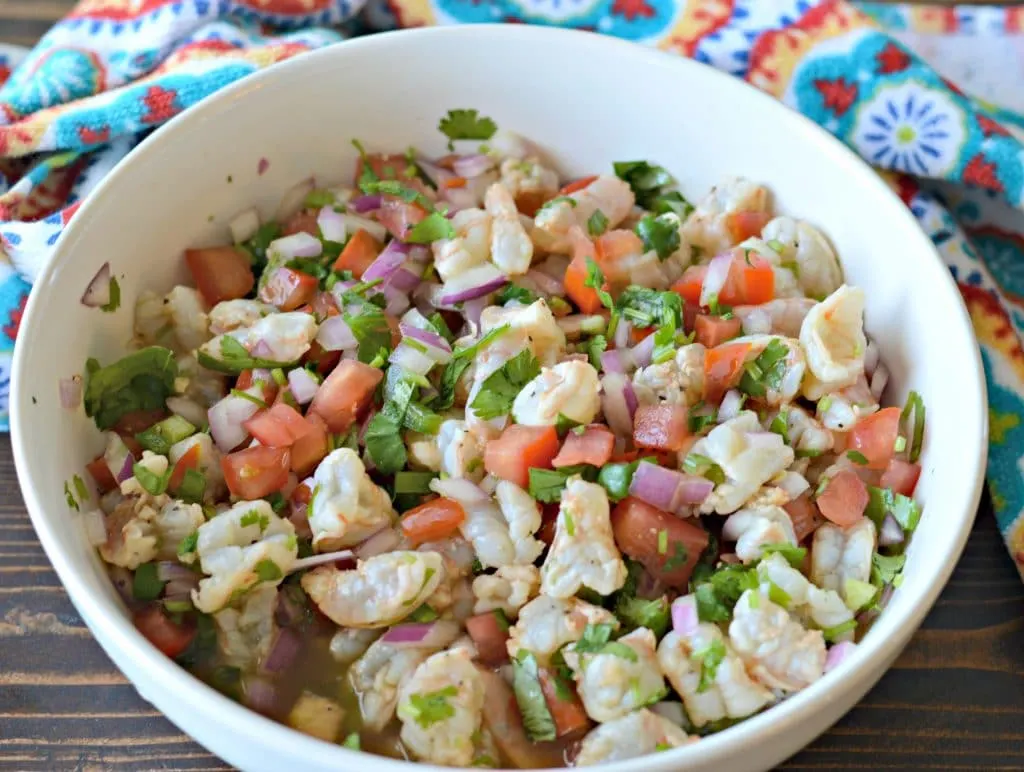 Mixing the shrimp ceviche in a large bowl