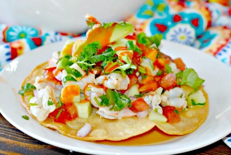 Shrimp Ceviche made with shrimp, lime juice, avocado, jalapeño, cilantro and finished off with hot sauce for some delicious heat.
