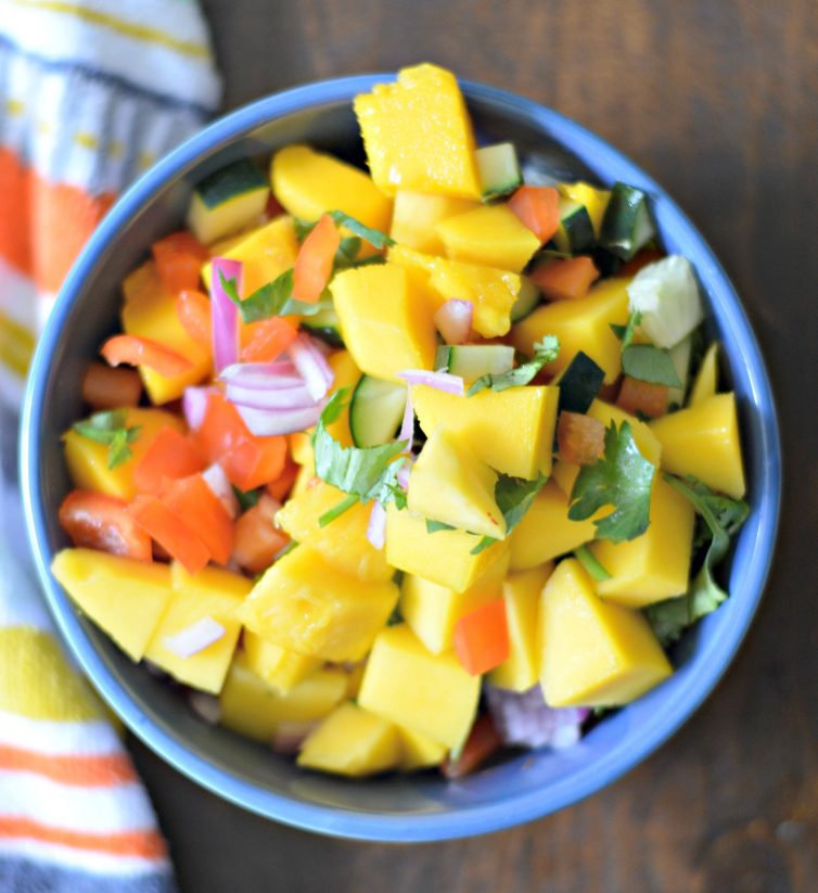 This fresh and easy mango and cucumber salsa, with fresh mango, cucumber, and more, will hit all the spots this summer.