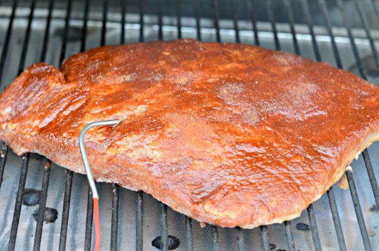 This Smoked Brisket Recipe will have everyone licking their fingers and asking for more. The secret is in the delicious, homemade mop sauce and the slow cook on the Traeger wood pellet grill. 