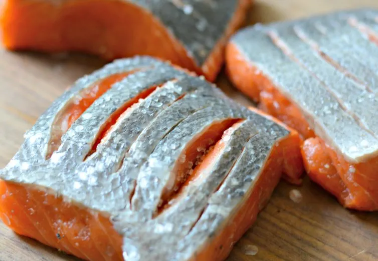 Keep reading to find out how to make a tasty crispy skin salmon with lemon garlic sauce using delicious Alaska king salmon.