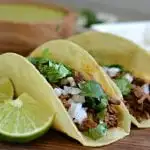 Barbacoa tacos with cilantro and onions