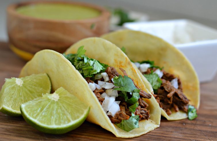 Barbacoa tacos with cilantro and onions