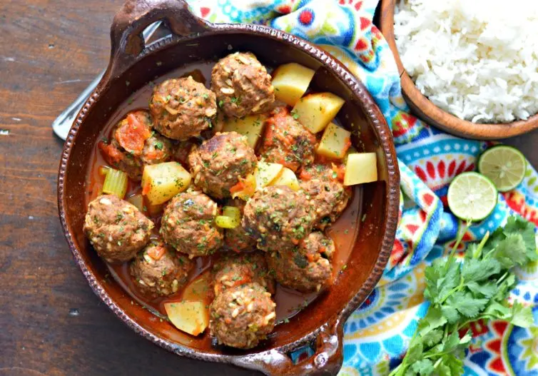 Mexican meatball soup (albondigas) with garnishes