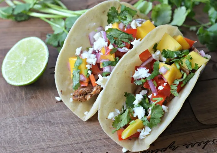 Jerk Chicken Tacos with mango salsa and lime