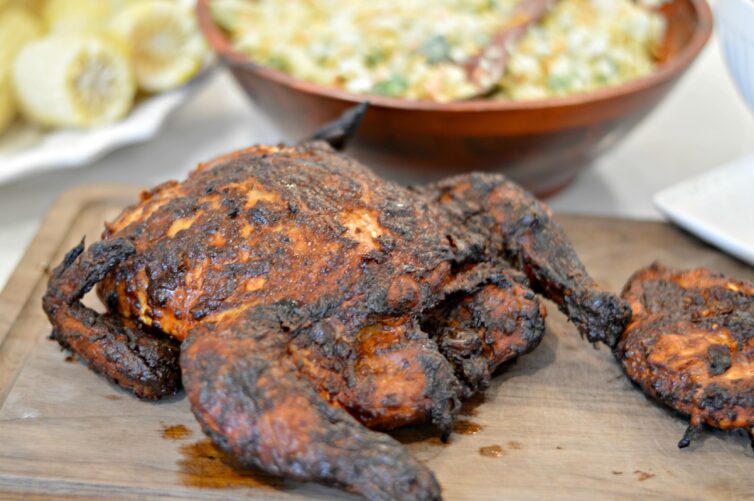 Smoked Whole Chicken with salad in the background