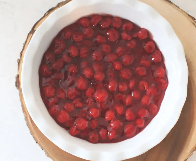 Cherry Pie filling in a white dish