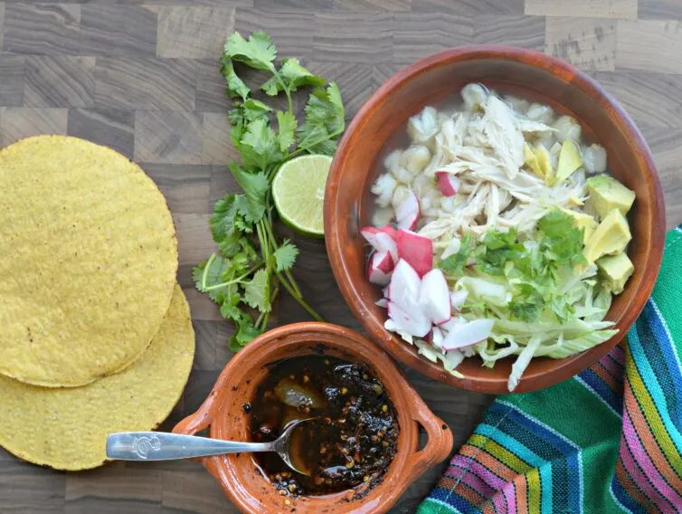 Pozole blanco on a table ready to eat