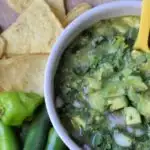 avocado salsa with chips and peppers