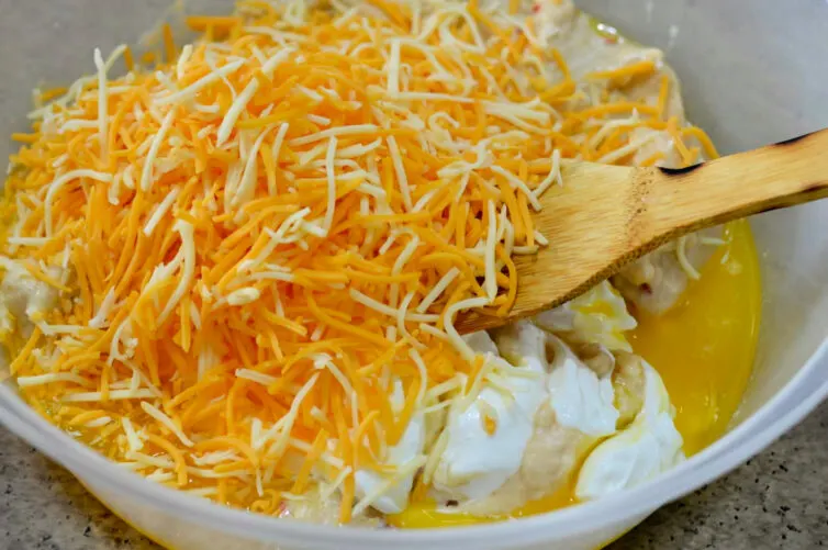 cheese, sour cream, cream of chicken soup and butter in a large bowl
