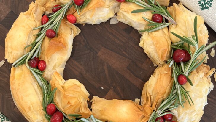 Christmas wreath pastry decorated with cranberries